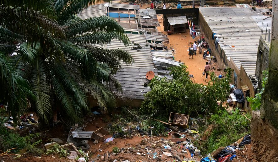 A view of the houses damaged by landslides in an informal settlement of Attecoube, in Abidjan, Ivory Coast, Tuesday, June 30, 2026. (AP Photo/Diomande Ble Blonde)