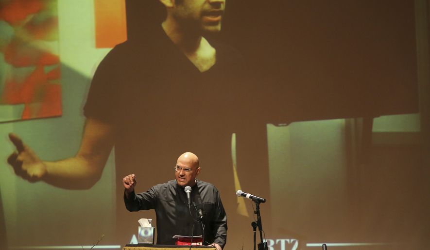 Roy Singham, founder and chairman of Freedom to Connect, speaks during the memorial service for Aaron Swartz, Saturday, Jan. 19, 2013 in New York. Friends and supporters of Swartz paid tribute Saturday to the free-information activist and online prodigy, who killed himself last week as he faced trial on hacking charges. (AP Photo/Mary Altaffer) **FILE**