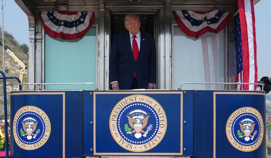 President Donald Trump arrives on the Freedom 250 train, Wednesday, July 1, 2026, in Medora, N.D., for the grand opening of the Theodore Roosevelt President Library. (AP Photo/Julia Demaree Nikhinson)