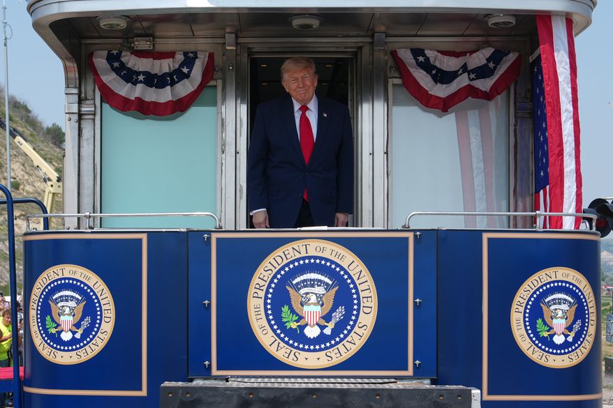 President Donald Trump arrives on the Freedom 250 train, Wednesday, July 1, 2026, in Medora, N.D., for the grand opening of the Theodore Roosevelt President Library. (AP Photo/Julia Demaree Nikhinson)