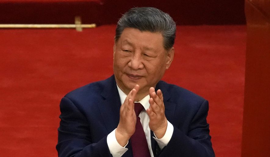 Chinese President Xi Jinping applauds during a ceremony to mark the 105th anniversary of the founding of the Chinese Communist Party at the Great Hall of the People in Beijing, Wednesday, July 1, 2026. (AP Photo/Ng Han Guan)
