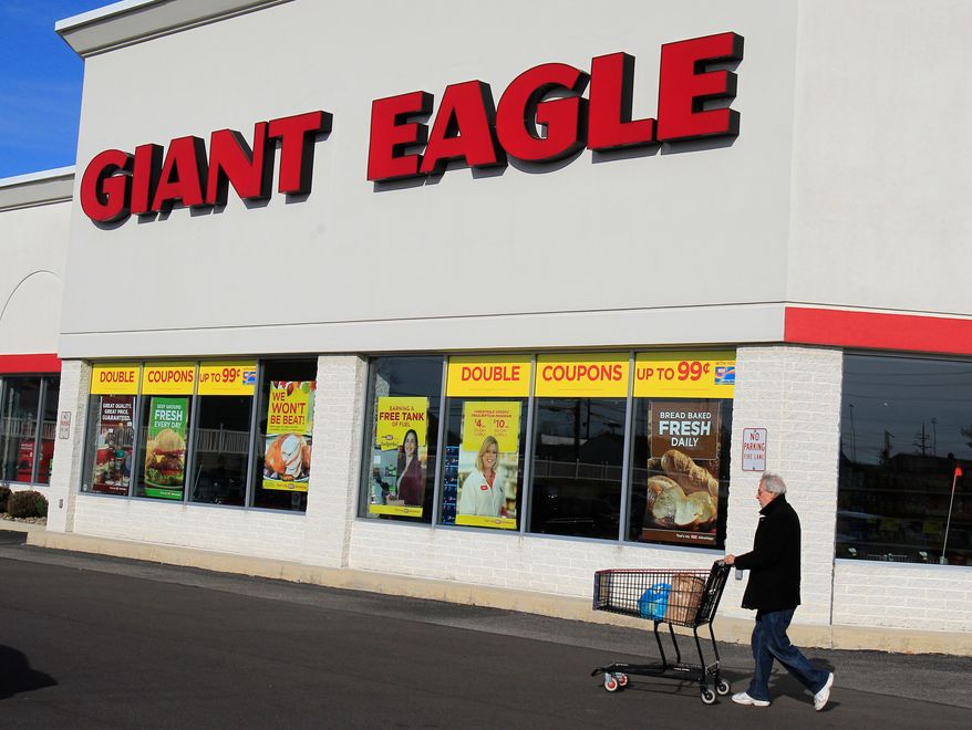 A man walks out of the Giant Eagle grocery store Thursday, Nov. 17, 2011, in Mayfield Heights, Ohio. (AP Photo/Tony Dejak, File)