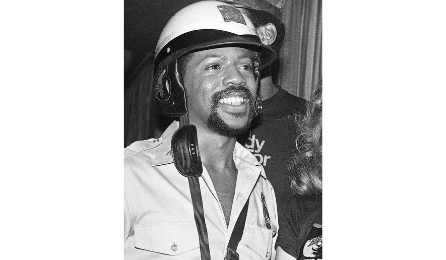 FILE - Victor Willis, a member of the disco group The Village People, appears during a Halloween party in Los Angeles on Oct. 31, 1979. (AP Photo/George Brich, File)