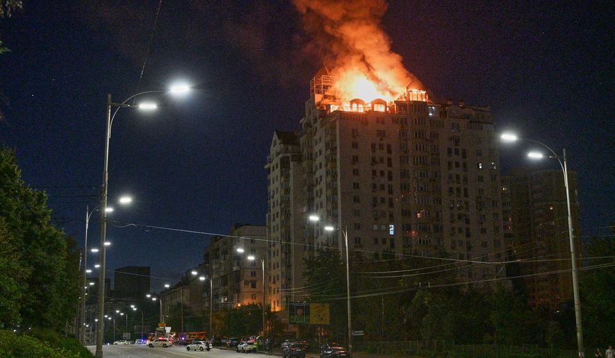 An apartment building burns after a Russian missile attack in Kyiv, Ukraine, Thursday, July 2, 2026. (AP Photo/Danylo Antoniuk)