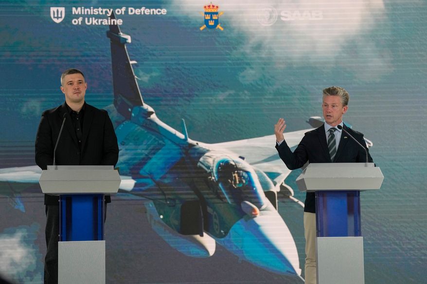 Ukraine's Defense Minister Mykhailo Fedorov, left, and Sweden's Defense Minister Pal Jonson hold a press conference in Kyiv, Ukraine, Wednesday, July 1, 2026. (AP Photo/Efrem Lukatsky)