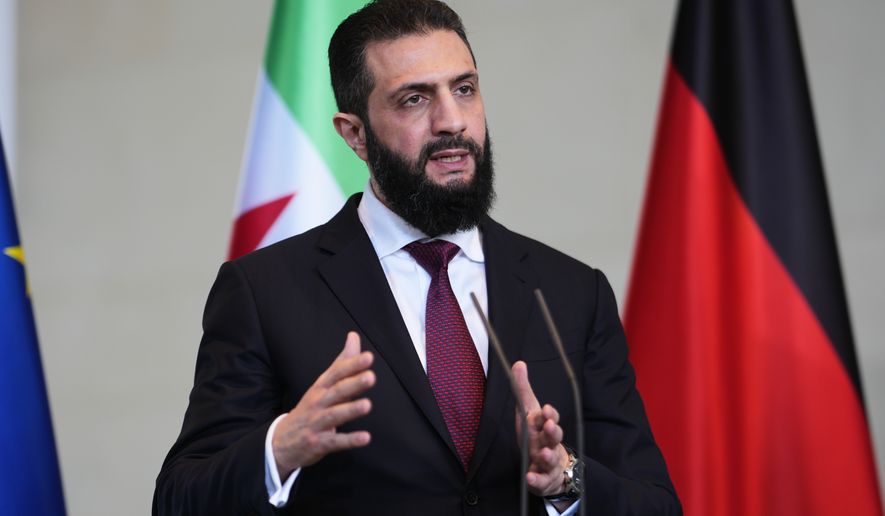 FILE - Syrian President Ahmad al-Sharaa attends a press conference after meeting with German Chancellor Friedrich Merz in Berlin, Germany, on March 30, 2026. (AP Photo/Markus Schreiber, File)