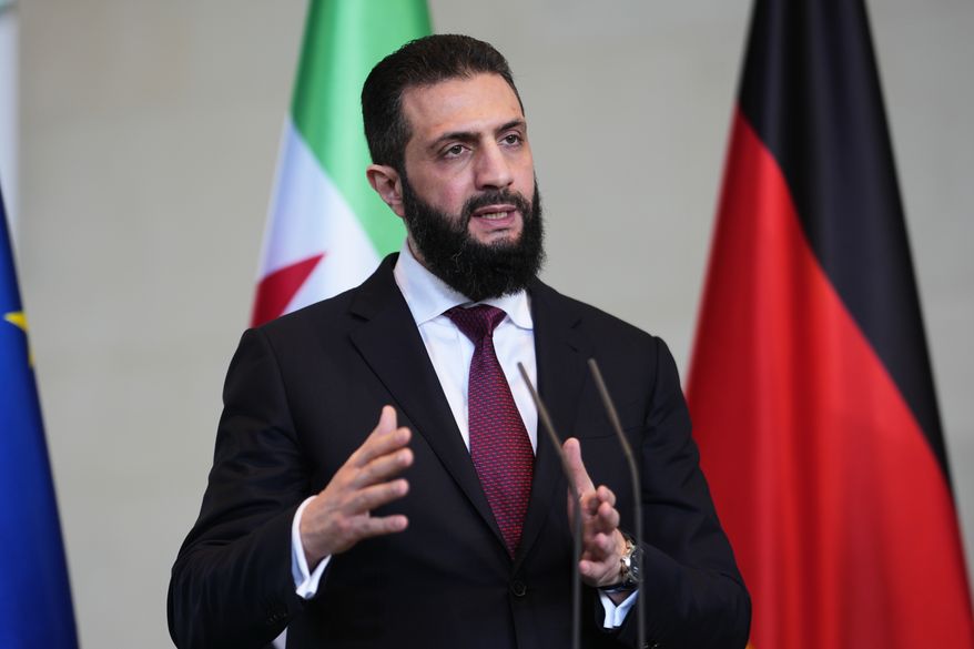 FILE - Syrian President Ahmad al-Sharaa attends a press conference after meeting with German Chancellor Friedrich Merz in Berlin, Germany, on March 30, 2026. (AP Photo/Markus Schreiber, File)