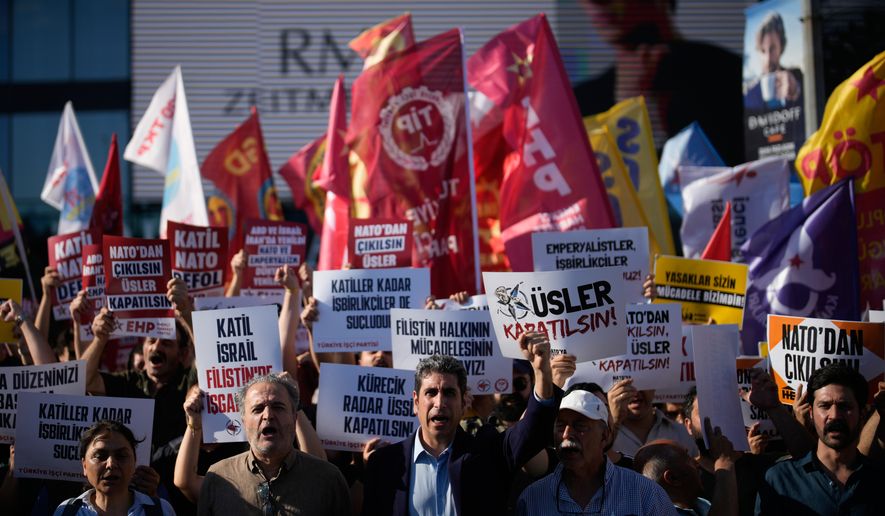 Demonstrators chant slogans and raise placards, during an anti-NATO protest in Istanbul, Turkey, Saturday, June 27, 2026, days ahead of the NATO summit scheduled to be held in Ankara on July 7-8.(AP Photo/Khalil Hamra)