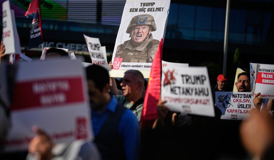 Demonstrators chant slogans and raise placards, including a sign depicting U.S. President Donald Trump, during an anti-NATO protest in Istanbul, Turkey, Saturday, June 27, 2026, days ahead of the NATO summit scheduled to be held in Ankara on July 7-8.(AP Photo/Khalil Hamra)