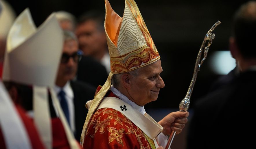 Pope Leo XIV leaves after a Mass where he conferred the pallium on newly appointed metropolitan archbishops, in St. Peter's Basilica, at the Vatican, Monday, June 29, 2026. (AP Photo/Alessandra Tarantino)