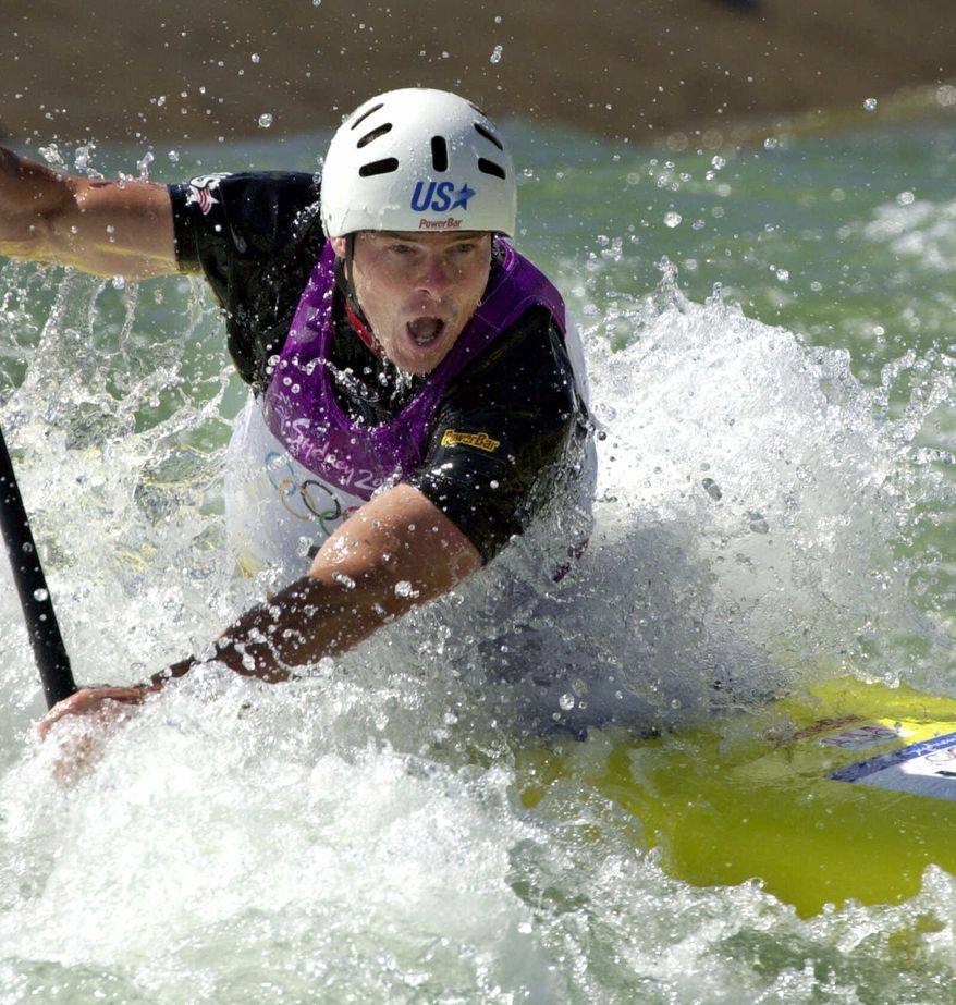 American David Hearn fights through the rapids during his first run in the finals Monday, Sept. 18, 2000, at the whitewater Stadium in Penrith, Australia.(AP Photo/Koji Sasahara)