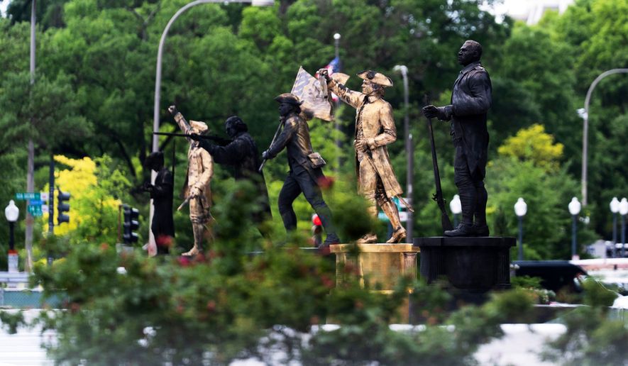 Bronze statues are seen installed at the fenced-off Freedom Plaza in Washington on Thursday, May 28, 2026. (AP Photo/Manuel Balce Ceneta) **FILE**