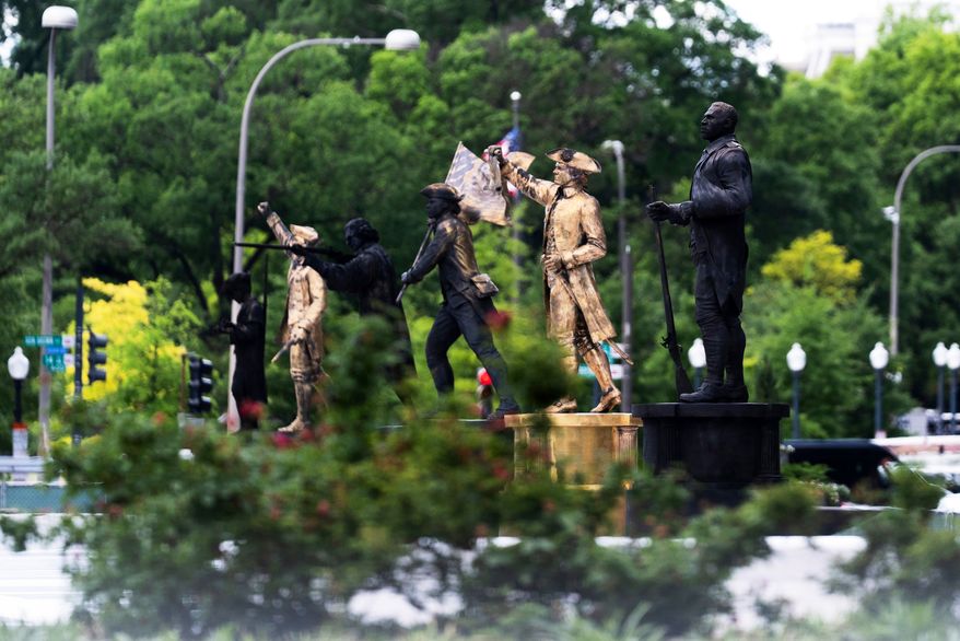 Bronze statues are seen installed at the fenced-off Freedom Plaza in Washington on Thursday, May 28, 2026. (AP Photo/Manuel Balce Ceneta) **FILE**