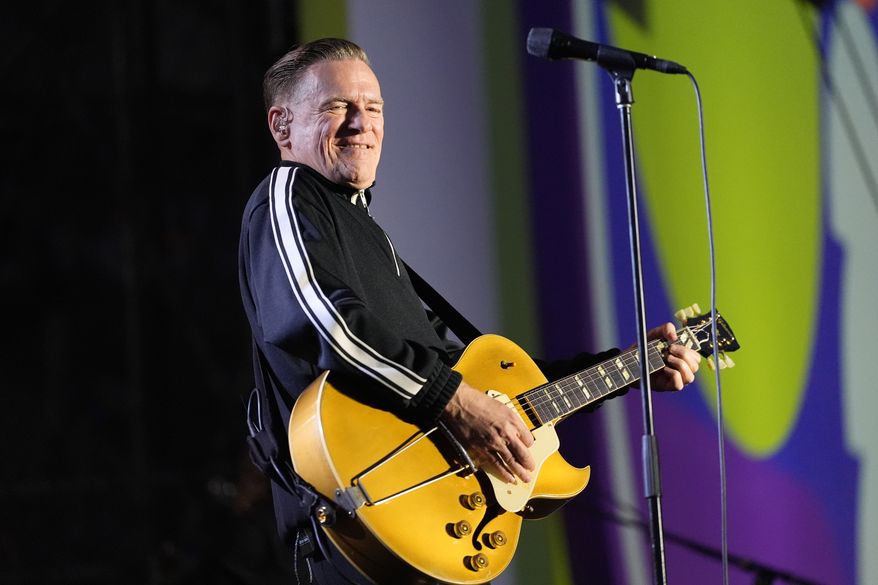 Bryan Adams performs during a countdown concert ahead of the World Cup soccer tournament on Wednesday, June 10, 2026, in Toronto. (AP Photo/Stephanie Scarbrough)