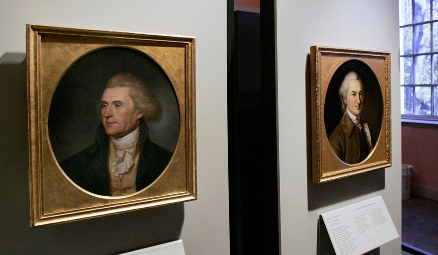 FILE - Portraits of a red-headed Thomas Jefferson, left, and John Dickinson, right, by by Charles Willson Peale are seen at the refurbished Second Bank of the United States in Philadelphia on Nov. 26, 2004. (AP Photo/Jacqueline Larma, File)