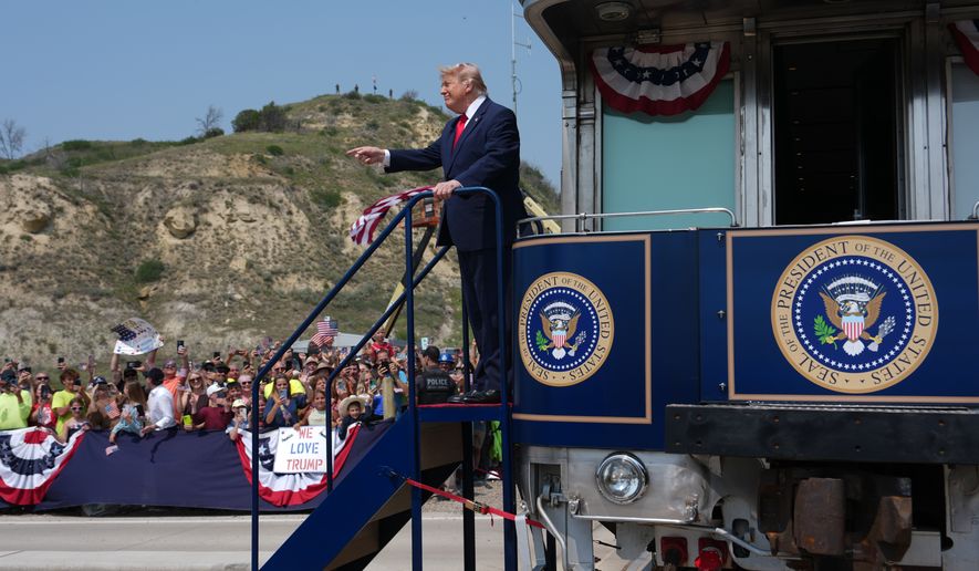 President Donald Trump arrives on the Freedom 250 train, Wednesday, July 1, 2026, in Medora, N.D., for the opening of the Theodore Roosevelt President Library. (AP Photo/Julia Demaree Nikhinson)