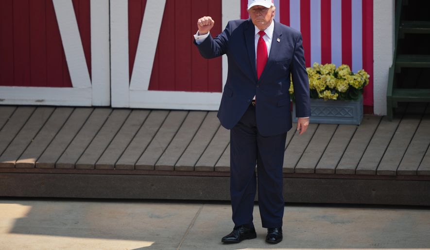 President Donald Trump leaves the stage after speaking at the Burning Hills Amphitheater during the Theodore Roosevelt Presidential Library opening ceremony Wednesday, July 1, 2026. (AP Photo/Matt Rourke)