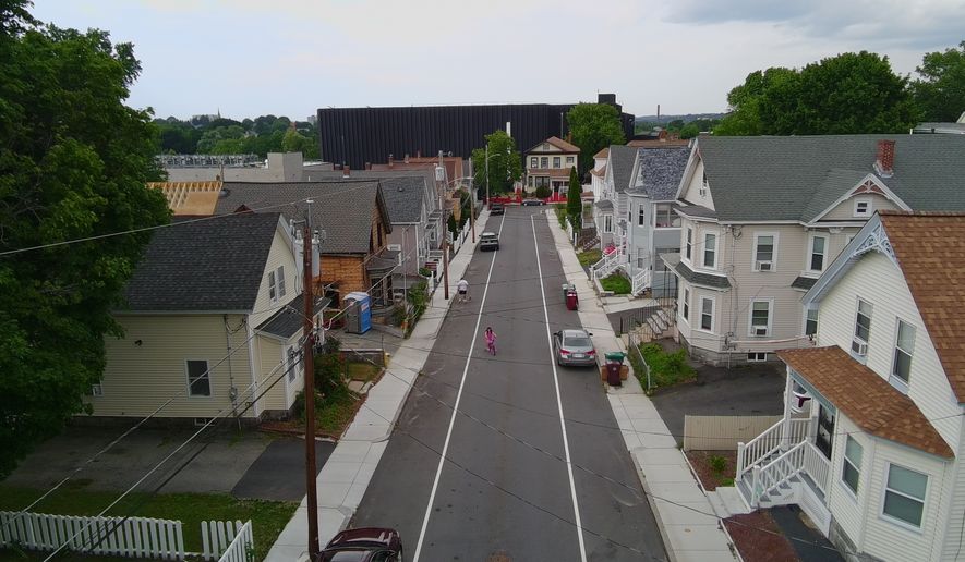 A data center built by the Markley Group looms over a residential neighborhood in Lowell, Mass., on June 30, 2026. (AP Photo/Matt O'Brien)