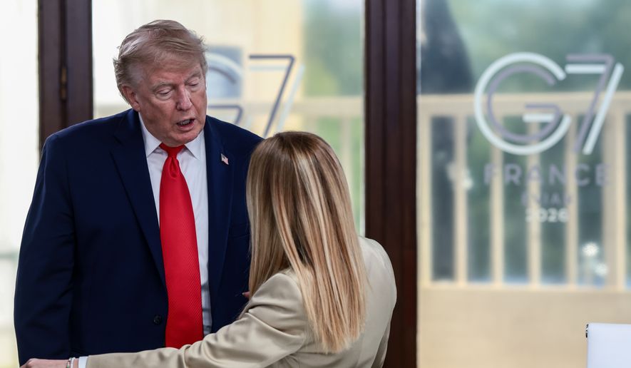 President Donald Trump speaks with Italian Prime Minister Giorgia Meloni at a working lunch with leaders of G7 and the Middle East in Evian-les-Bains, France, Tuesday, June 16, 2026. (Evelyn Hockstein/Pool Photo via AP, File)