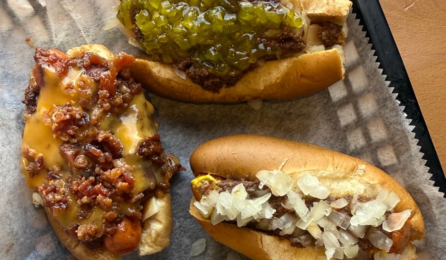 Three dressed mini hot dogs are displayed at Hot Dog Ranch in Pittsfield, Mass., in June 2026. (Katie Workman via AP)