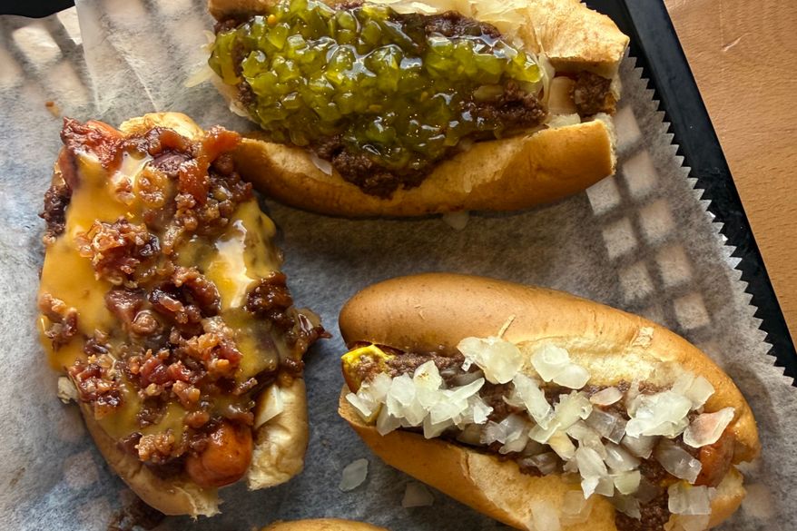 Three dressed mini hot dogs are displayed at Hot Dog Ranch in Pittsfield, Mass., in June 2026. (Katie Workman via AP)