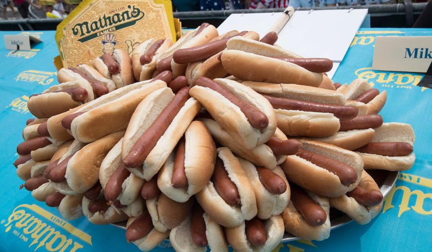 Hot dogs are displayed on stage ahead of the Nathan's Famous Fourth of July hot dog eating contest in New York's Coney Island on July 4, 2018. (AP Photo/Mary Altaffer) **FILE**
