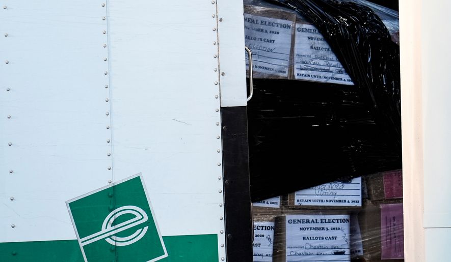 FILE - Georgia general election 2020 ballots are loaded by the FBI onto trucks at the Fulton County Election HUB, Jan. 28, 2026, in Union City, Ga., near Atlanta. (AP Photo/Mike Stewart, File)