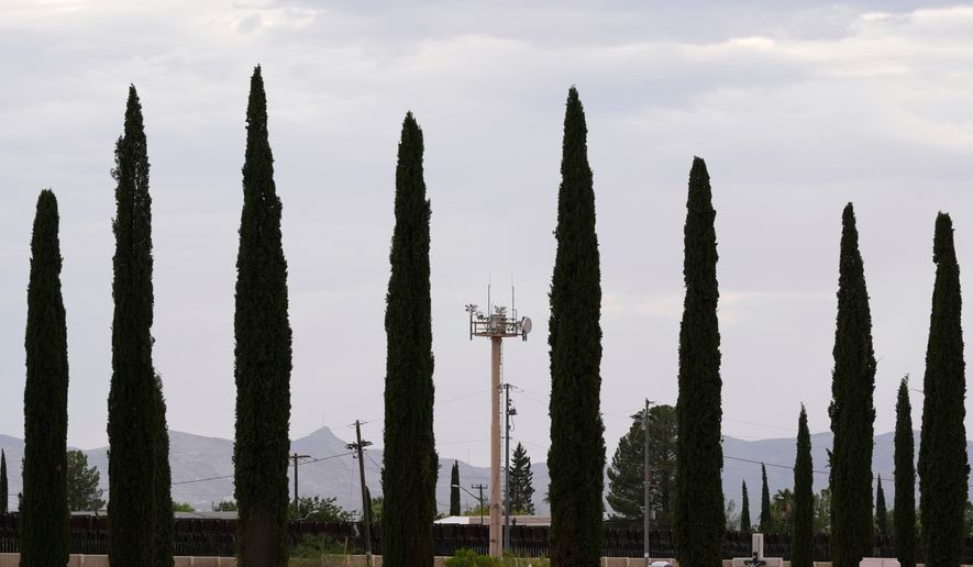 FILE - Surveillance technology used by various law enforcement sit on a tower at the border wall, July 28, 2025, in Douglas, Ariz. (AP Photo/Ross D. Franklin, File)