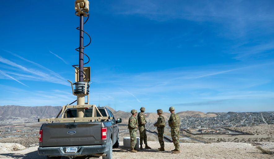 Army soldiers look at the border wall next to a surveillance vehicle during the visit to the U.S.-Mexico border by Defense Secretary Pete Hegseth in Sunland Park, N.M., on Feb. 3, 2025. (AP Photo/Andres Leighton) **FILE**