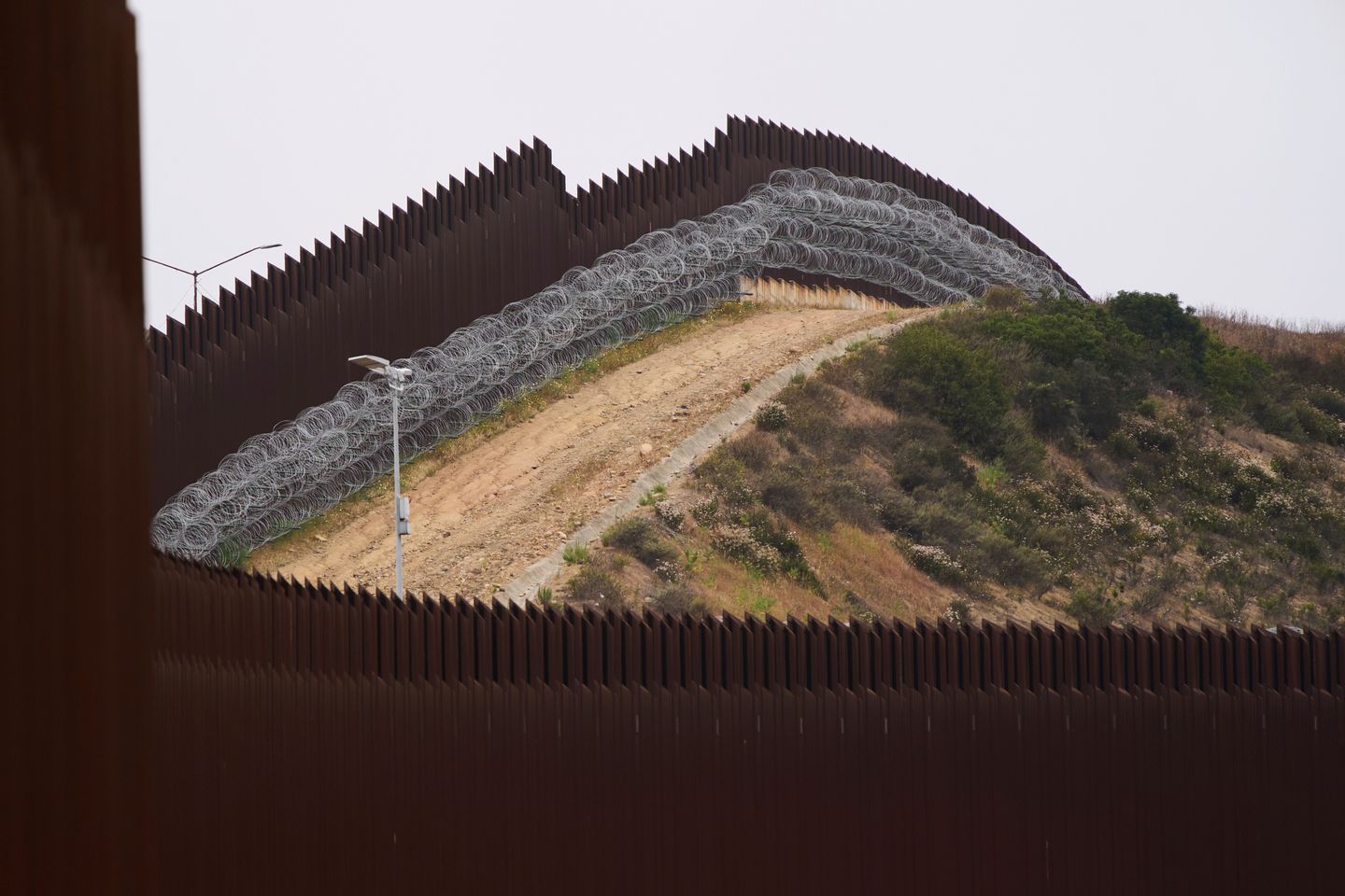 Freedom Caucus presses House leadership for a vote to make Trump's border policies law