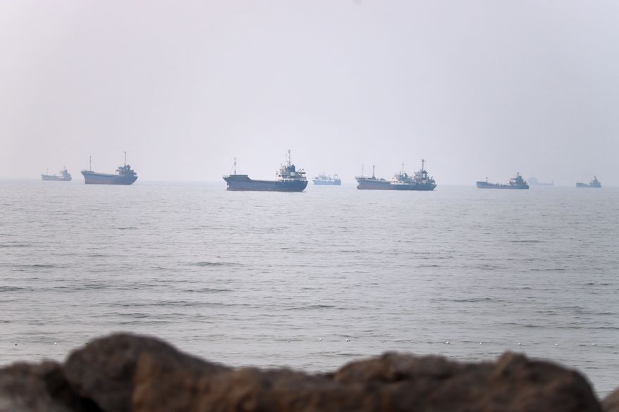 Commercial vessels are seen in the Strait of Hormuz off Bandar Abbas, Iran, Tuesday, June 30, 2026. (Amirhosein Khorgooi/ISNA via AP)