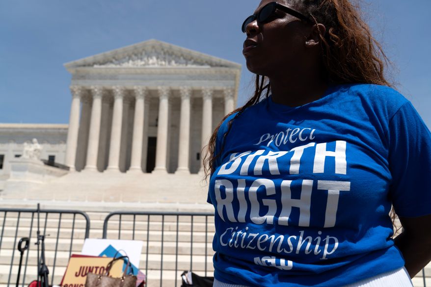 Activists celebrate the Supreme Court's birthright citizenship ruling outside of the Supreme Court on Capitol Hill, Tuesday, June 30, 2026, in Washington. (AP Photo/Jose Luis Magana)