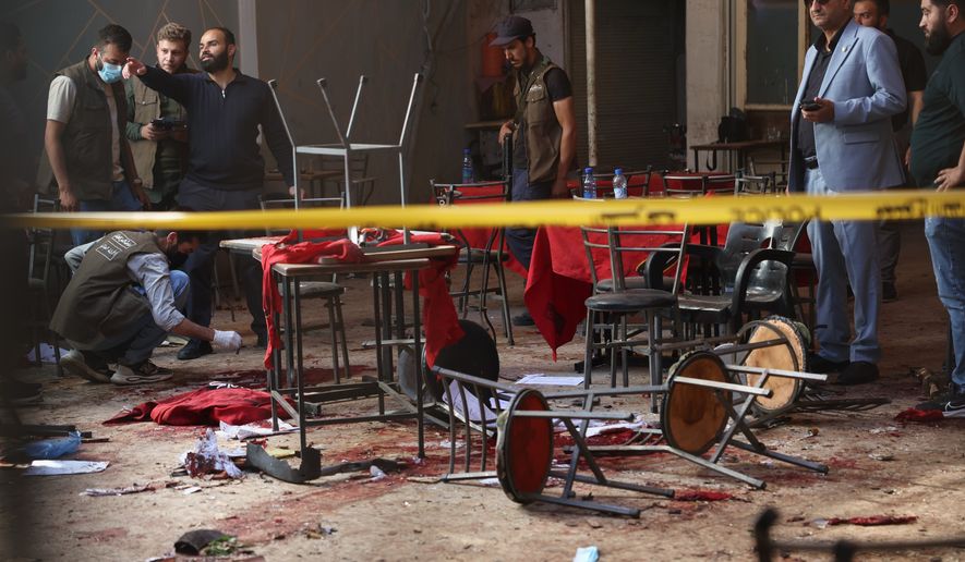 Syrian security inspects the site after an explosive device was detonated in a cafe near the main courthouse complex, in Damascus, Syria, Thursday, July 2, 2026 (AP Photo/Ghaith Alsayed)