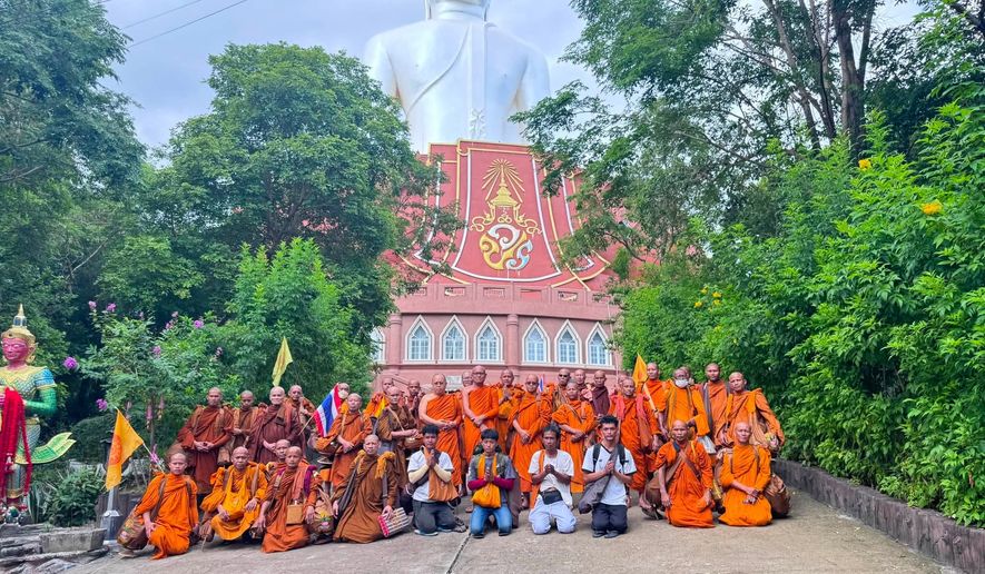 This photograph released by the Phu Manorom temple shows a group of Thai Buddhist monk posing for a picture at Phu Manorom temple in Mukdahan province, Thailand, Thursday, July 2, 2026 (Phu Manorom temple via AP)
