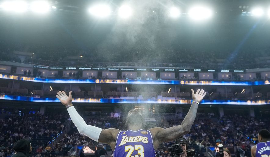 Los Angeles Lakers forward LeBron James throws chalk in the air before an NBA basketball game against the Golden State Warriors in San Francisco, April 9, 2026. (AP Photo/Jeff Chiu, File)