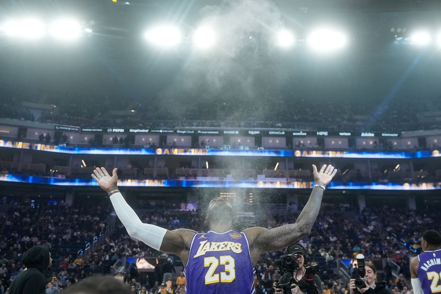 Los Angeles Lakers forward LeBron James throws chalk in the air before an NBA basketball game against the Golden State Warriors in San Francisco, April 9, 2026. (AP Photo/Jeff Chiu, File)