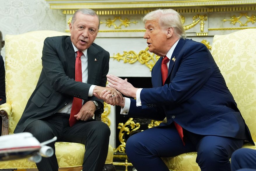 President Trump, right, shakes hands with Turkish President Recep Tayyip Erdogan during a meeting in the Oval Office of the White House, Sept. 25, 2025, in Washington. (AP Photo/Evan Vucci, File)
