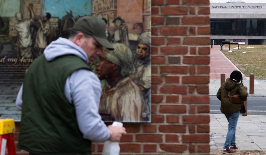 Panels that were part of an exhibit on slavery at the President's House Site in Independence National Historical Park are reinstalled, Feb. 19, 2026, in Philadelphia. (AP Photo/Joe Lamberti, File)