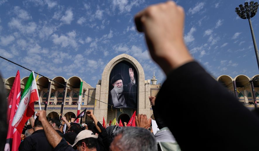 Mourners attend the start of the dayslong funeral ceremonies for slain Iranian Supreme Leader Ayatollah Ali Khamenei and members of his family at the Imam Khomeini Mosalla Grand Mosque in Tehran, Iran, Saturday, July 4, 2026. (AP Photo/Altaf Qadri)