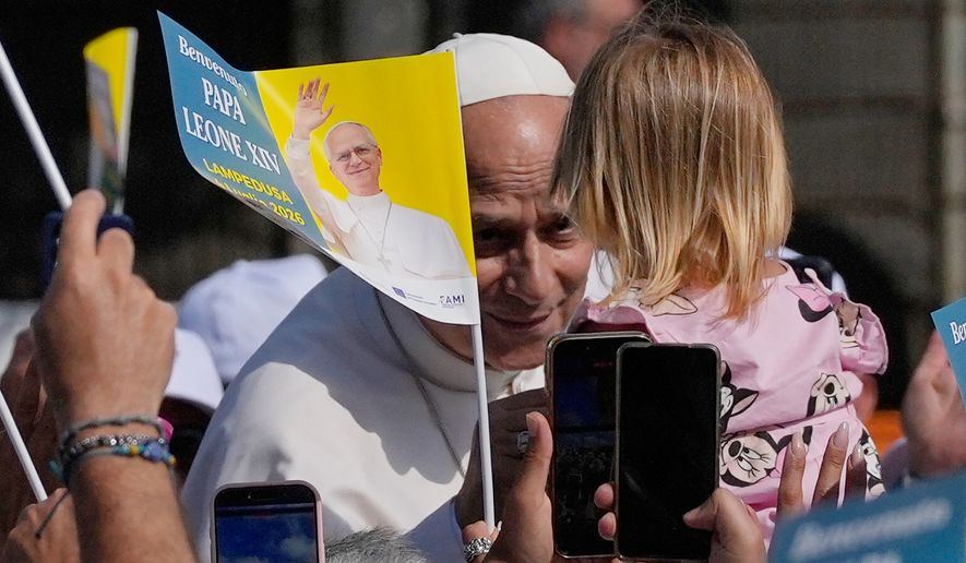 Pope Leo XIV arrives to celebrate Mass in Lampedusa, Sicily, southern Italy, Saturday, July 4, 2026, during a one-day pastoral visit to the Sicilian island that has come to symbolize the dramatic odyssey of migrants trying to reach Europe by sea. (AP Photo/Alessandra Tarantino)