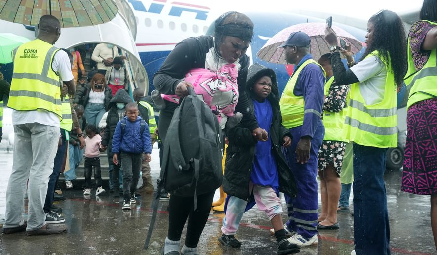 Nigerian nationals repatriated from South Africa, following concerns about unrest, arrive at the Murtala Muhammed International Airport in Lagos, Nigeria, Tuesday, June 30, 2026. (AP Photo/Sunday Alamba)