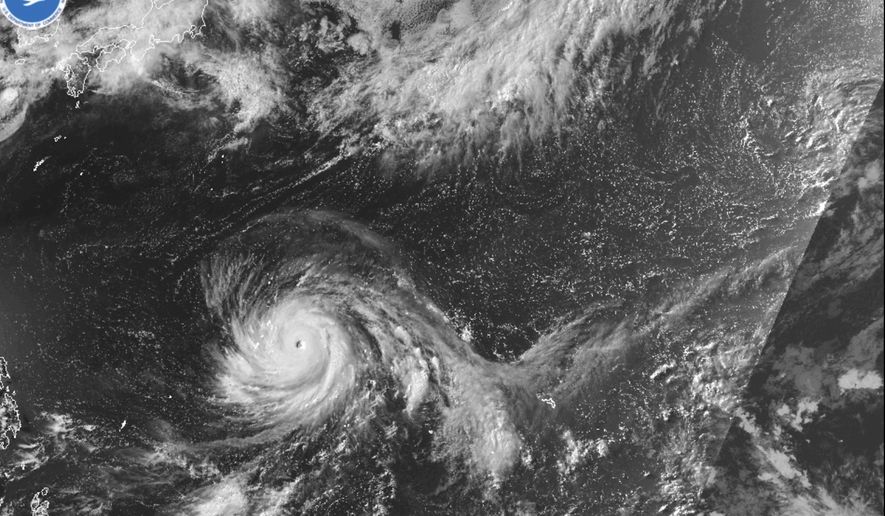 This satellite image from the National Oceanic and Atmospheric Administration shows Typhoon Bavi nearing the U.S. Pacific island territory of Guam on Sunday, July 5, 2026. (NOAA via AP)
