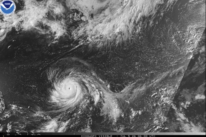 This satellite image from the National Oceanic and Atmospheric Administration shows Typhoon Bavi nearing the U.S. Pacific island territory of Guam on Sunday, July 5, 2026. (NOAA via AP)