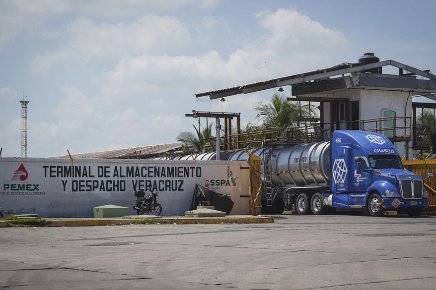 A tanker truck exits the Petroleos Mexicanos (PEMEX) fuel depot and distribution center in the port city of Veracruz, Mexico, Monday, Sept. 8, 2025. (AP Photo/Victoria Razo)