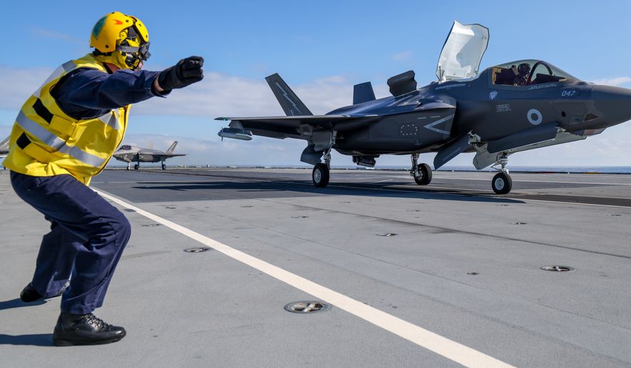 Royal Navy F-35B fighters of UK Carrier Strike Group launch from HMS Prince of Wales to intercept a Russian military aircraft, Thursday July 2, 2026. (Chris Sellars/Ministry of Defence via AP)