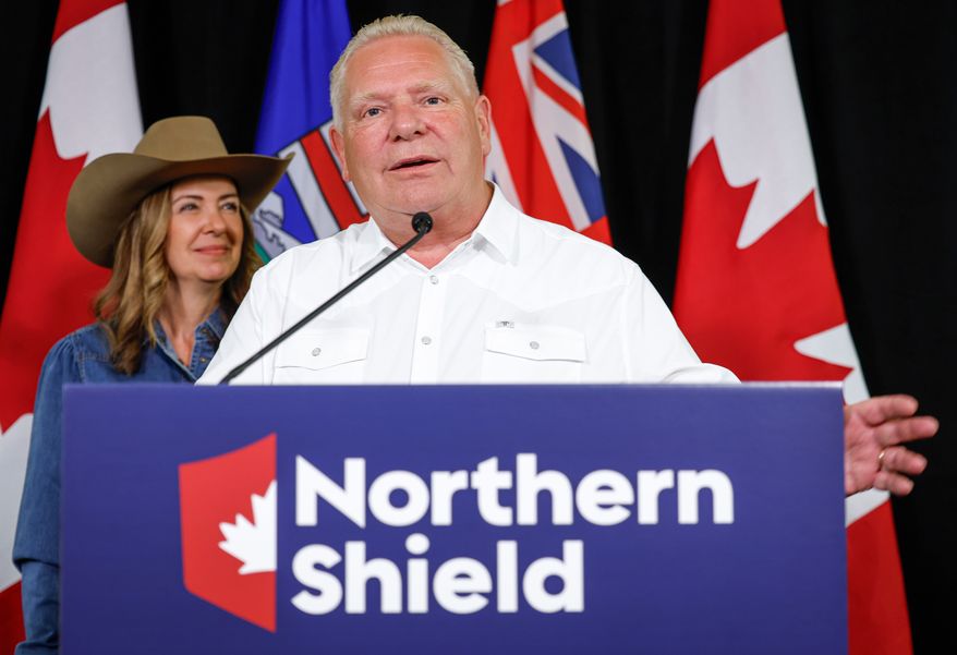 Ontario Premier Doug Ford and Alberta Premier Danielle Smith, left, announce the Northern Shield pipeline proposal in Calgary, Canada, Monday, July 6, 2026. (Jeff McIntosh/The Canadian Press via AP)
