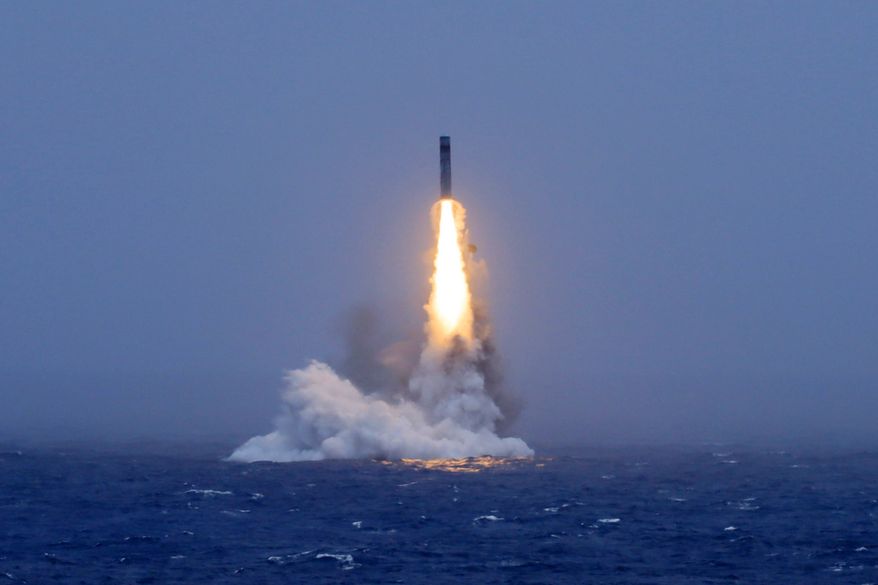 In this photo released by Xinhua News Agency, a long-range ballistic missile bursts out of the sea during a test launched from a Chinese nuclear-powered submarines in the South Pacific on Monday, July 6, 2026. (Li Xiangchao/Xinhua via AP)