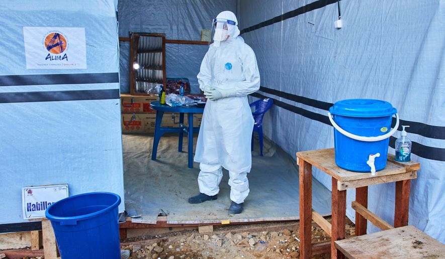 A health worker stands at the Evangelical Medical Center, in Bunia, eastern Congo, Friday, July 3, 2026, where Ebola clinical trials are scheduled to take place. (AP Photo/Dirole Lotsima Dieudonne)