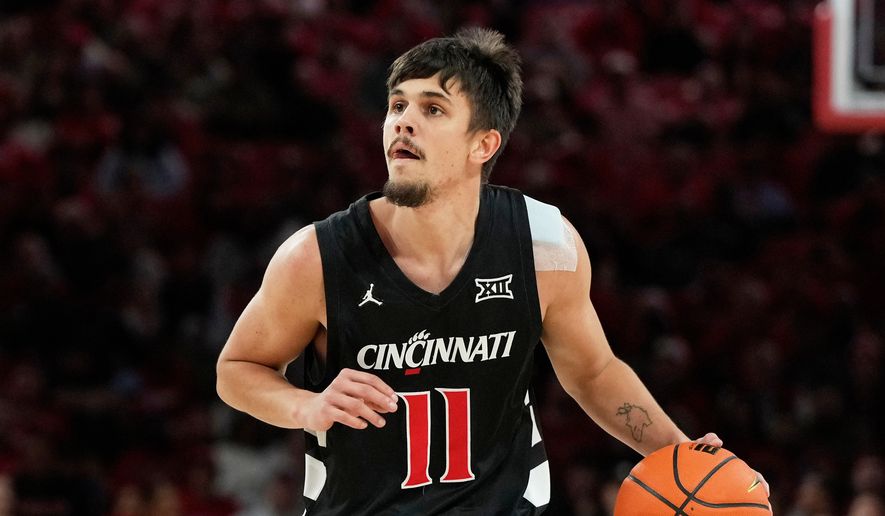 FILE - Cincinnati guard Kerr Kriisa (11) handles the ball during the first half of an NCAA college basketball game against Houston, Saturday, Jan. 31, 2026, in Houston. (AP Photo/Kevin M. Cox, File)