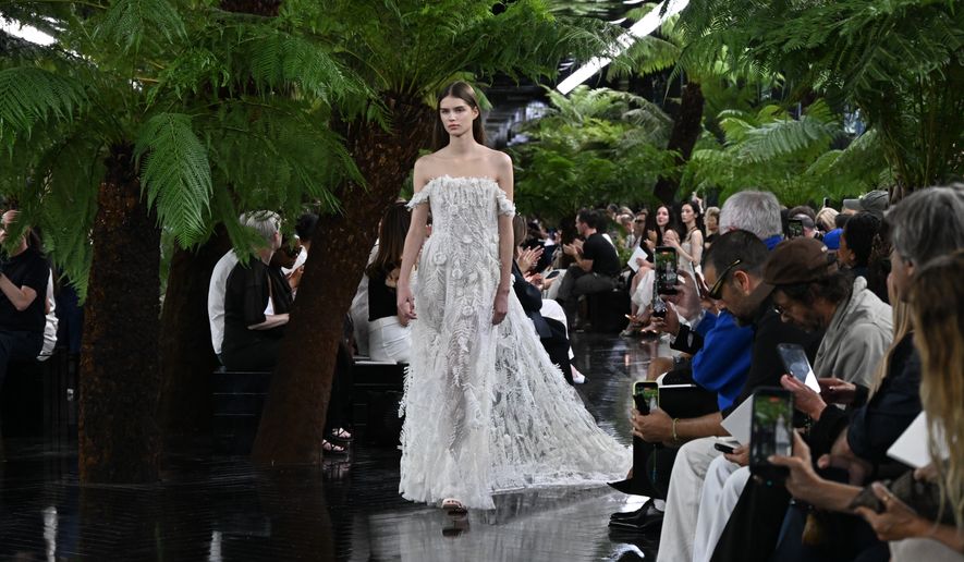 A model wears a creation as part of the Christian Dior Haute Couture Fall/Winter 2026-2027 Women's collection presented in Paris, Monday, July 6, 2026. (AP Photo/Emma Da Silva)